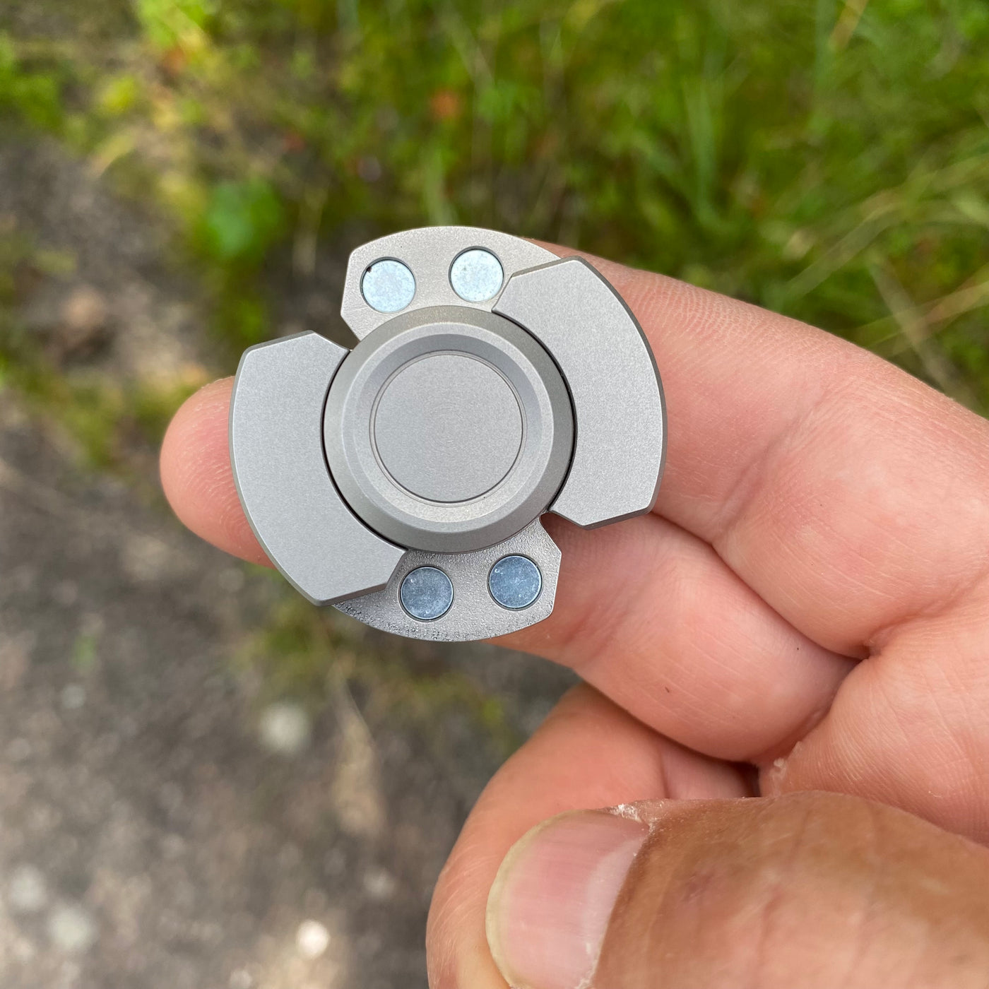 Solid steel fidget spinner/magnetic slider combo