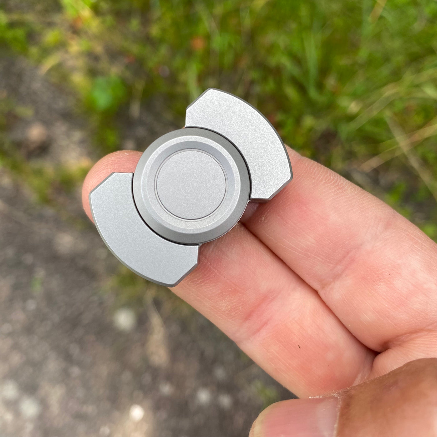 Solid steel fidget spinner/magnetic slider combo