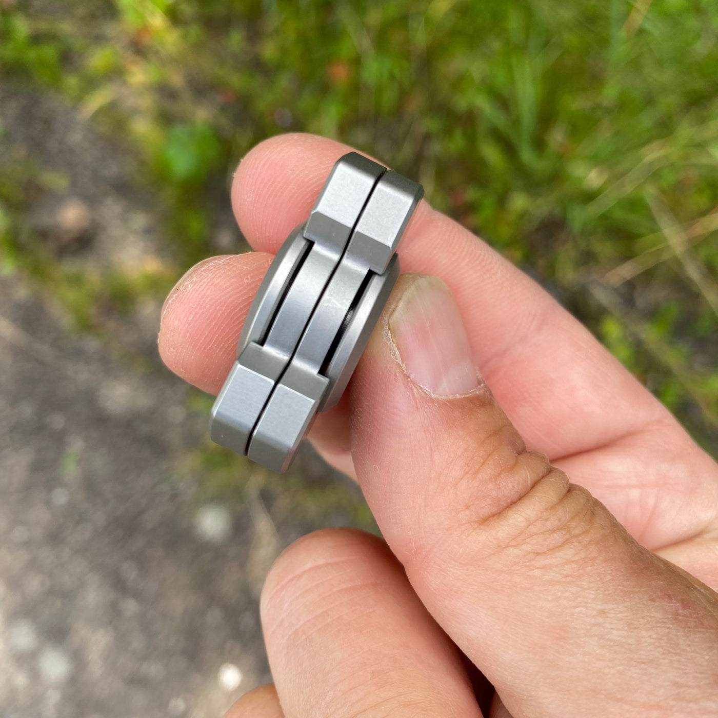 Solid steel fidget spinner/magnetic slider combo