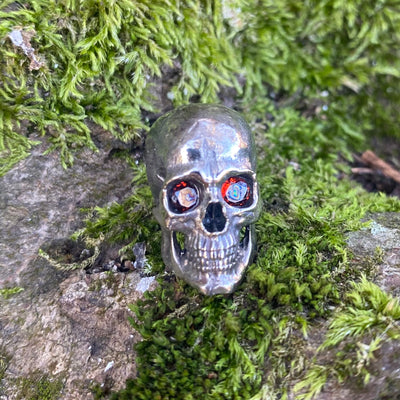 Realistic skull with garnet stone eyes limited bead