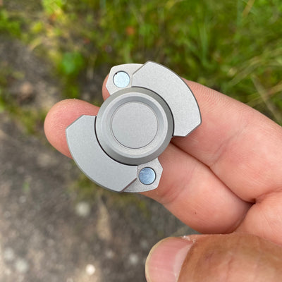 Solid steel fidget spinner/magnetic slider combo