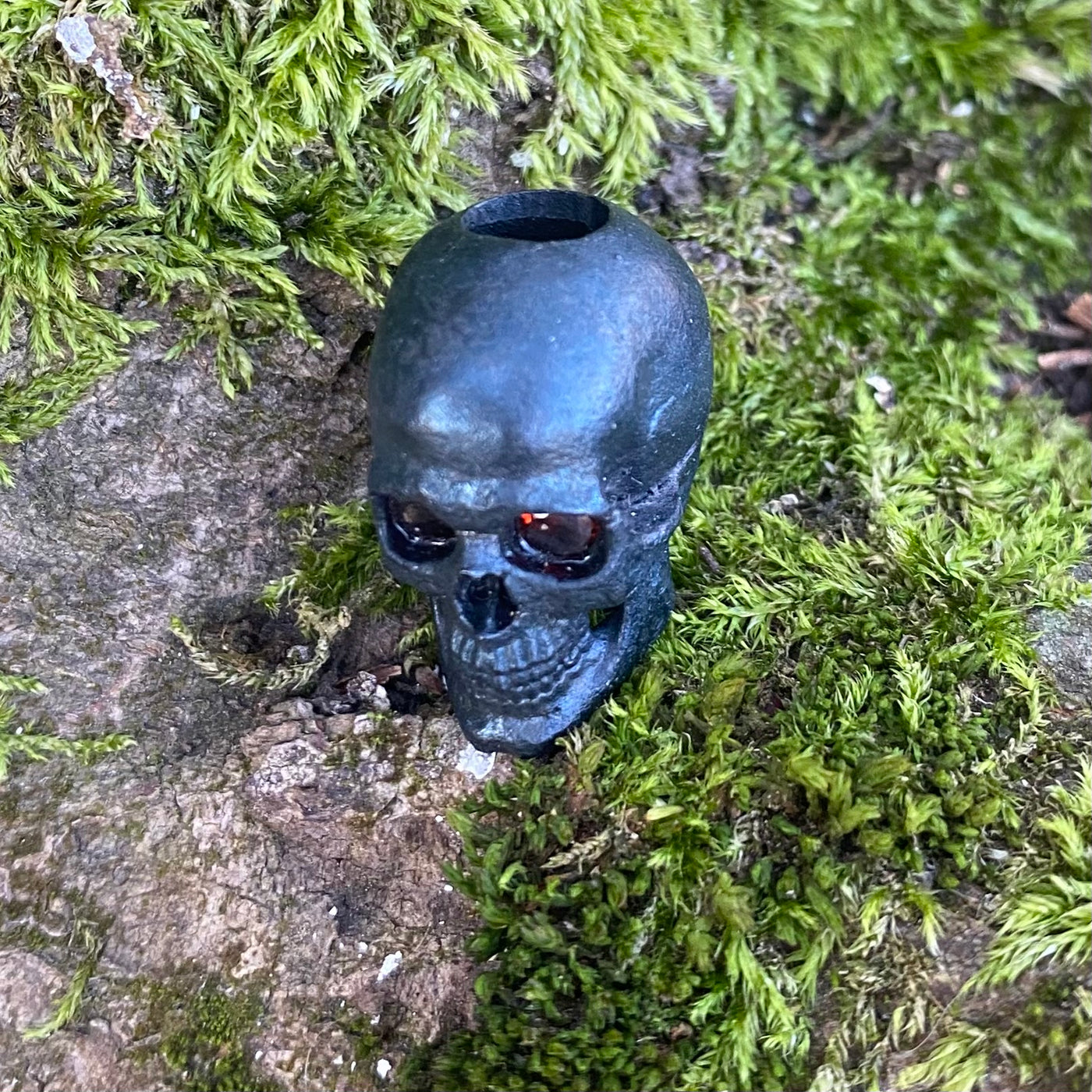 Realistic skull with garnet stone eyes limited bead